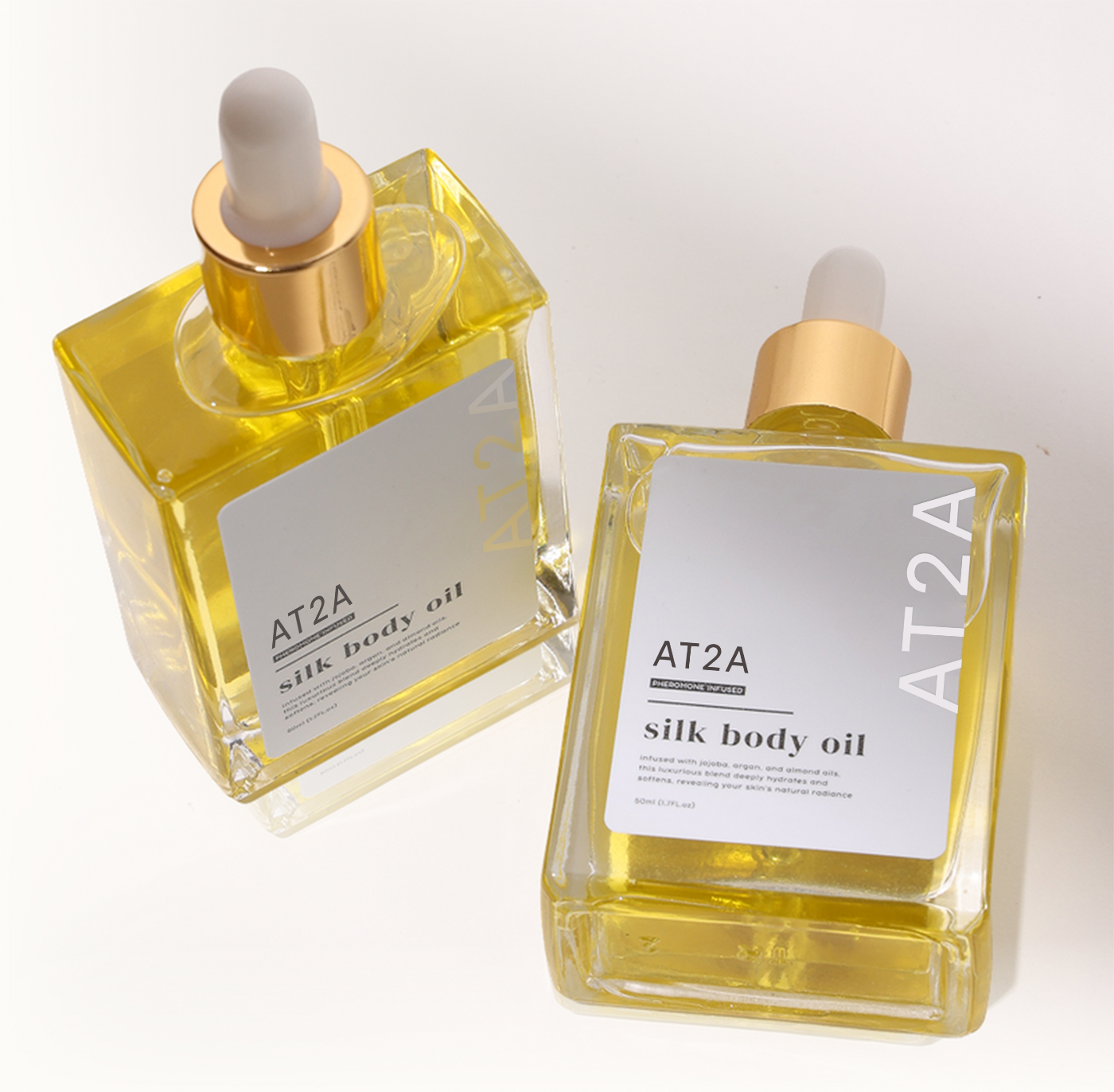 Two bottles of AT2A Silk Body Oil